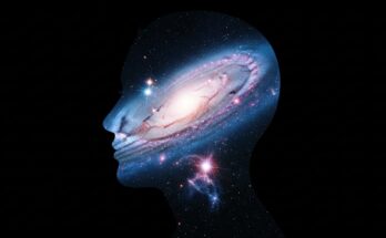 Silhouette of a human filled with stars and galaxies.